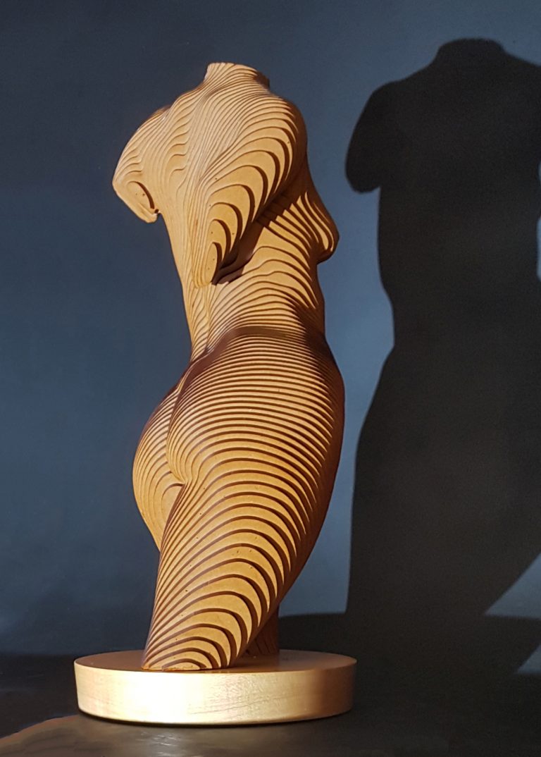 A wooden female torso in laminated MDF