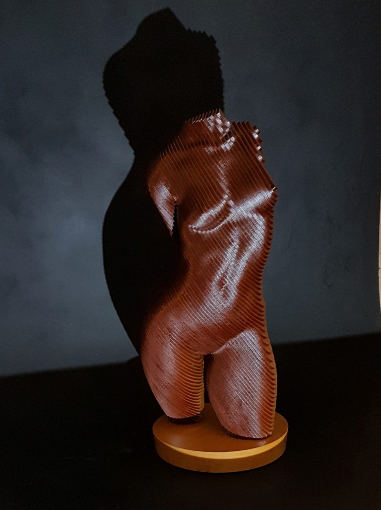 A wooden female torso in laminated MDF