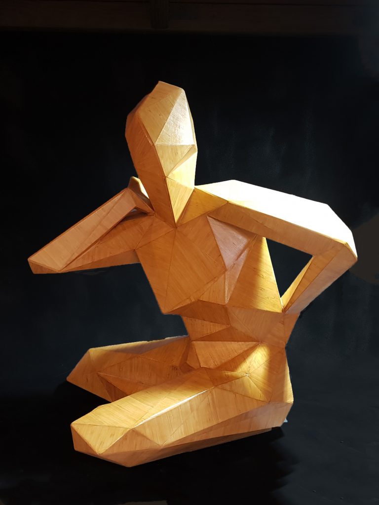 Bamboo sculpture of seated female figure